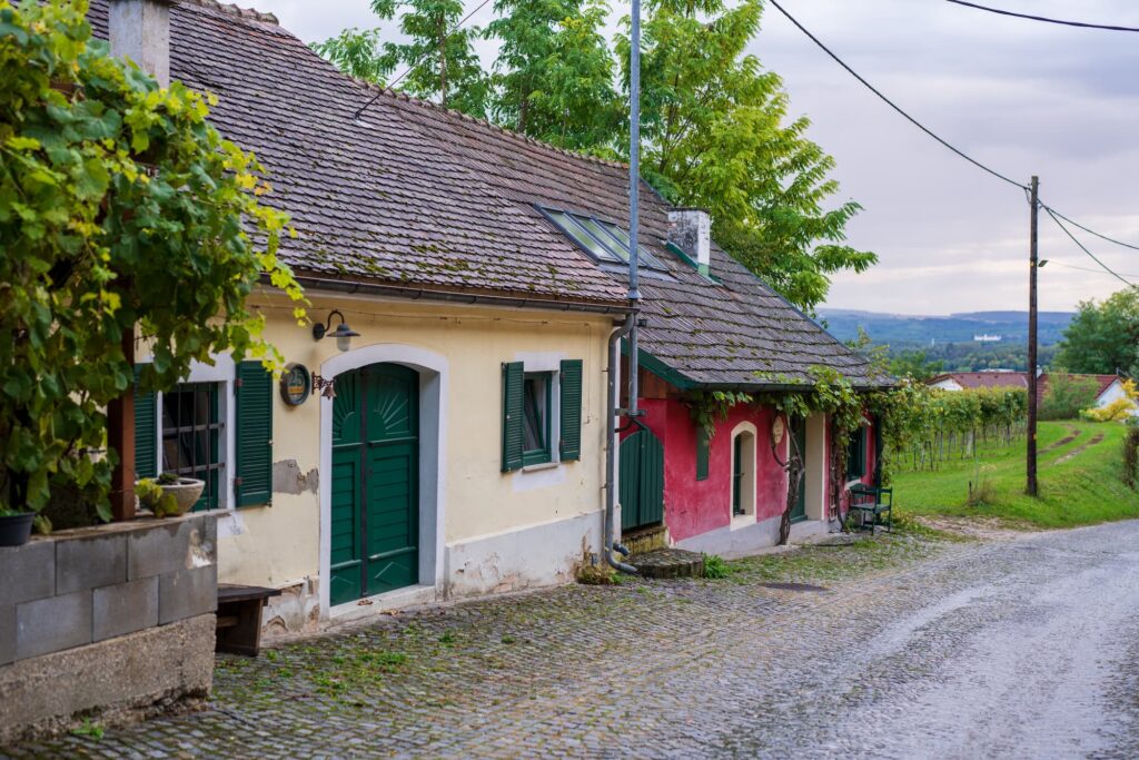 Rohrendorfer kellergasse with countryside landscape in the background