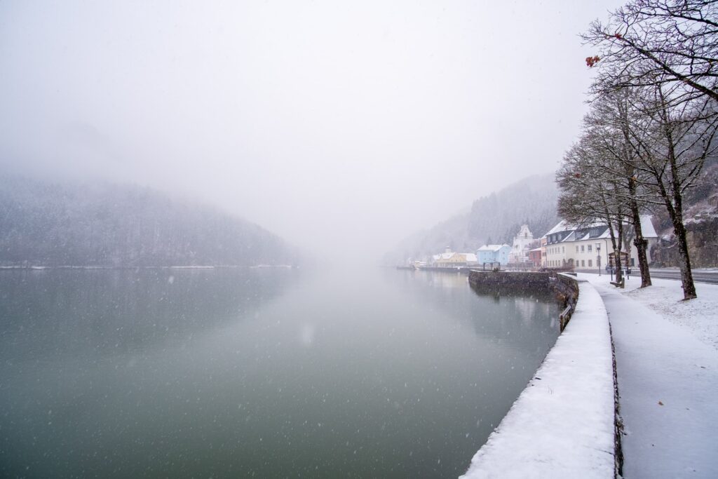 Cute tiny village of Sarmingstein on the Danube river during a snow storm
