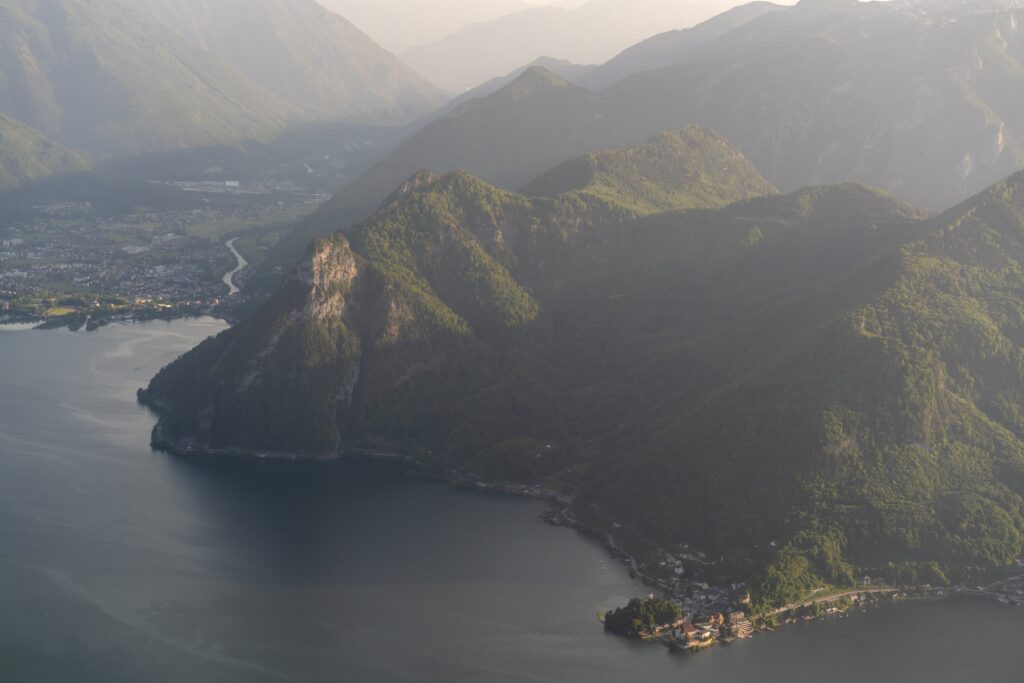 Late golden afternoon light illuminating the cute village of Traunkirchen jutting in to the lake from a peninsula