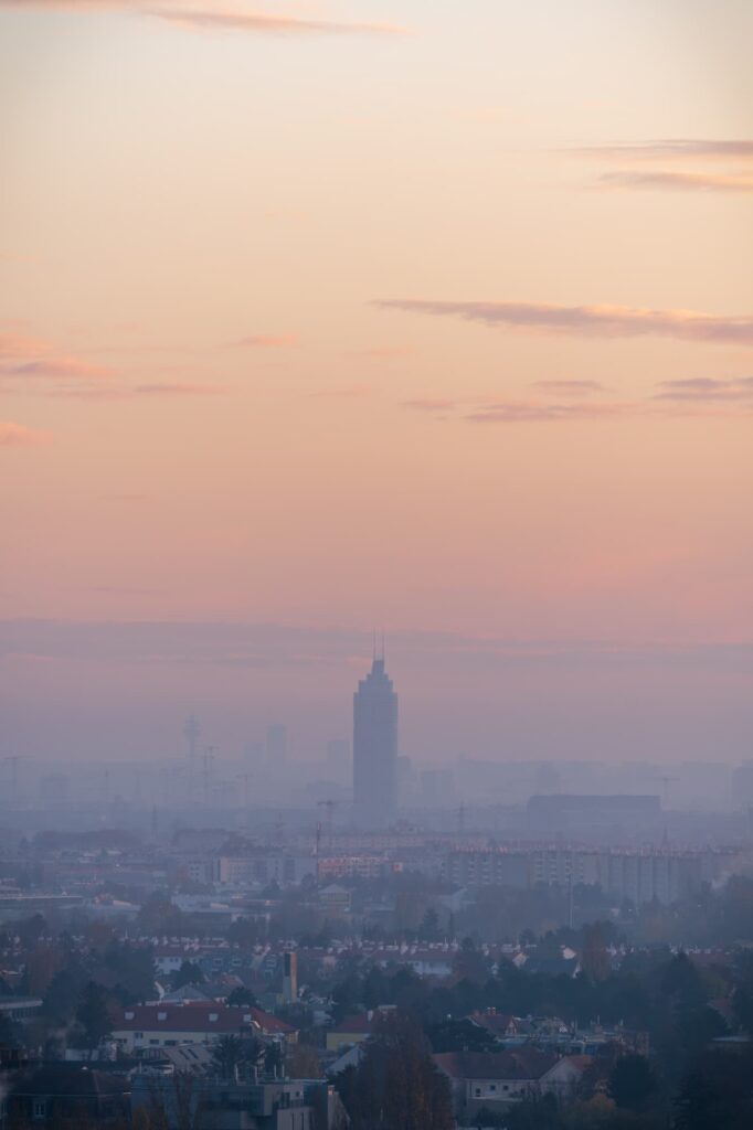 Sunset over Vienna from Stammersdorf with sky scrapers and pink and orange tones