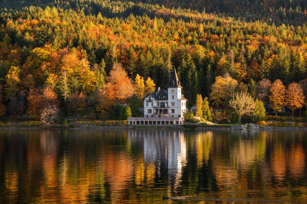 Villa Castiglioni on lake Grundlesee surrounded by vivid autumnal forests